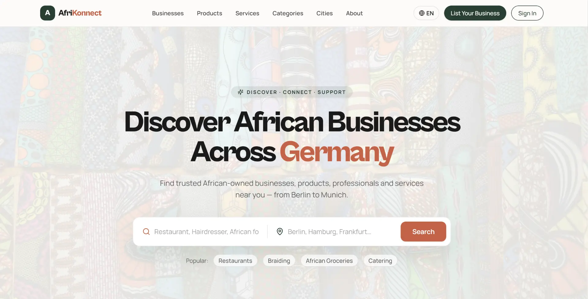 AfriKonnect homepage showing the headline Discover African Businesses Across Germany.